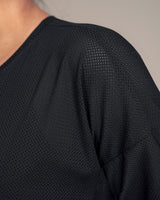 Camiseta deportiva en malla transpirable con recogido en espalda#color_700-negro