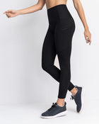 Legging deportivo de control con prácticos bolsillos laterales