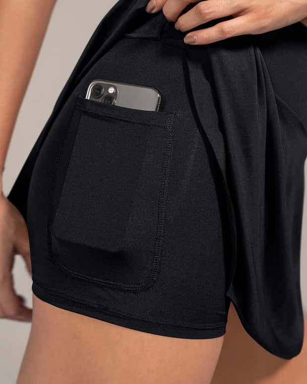 Falda deportiva con short interno con bolsillo#color_700-negro